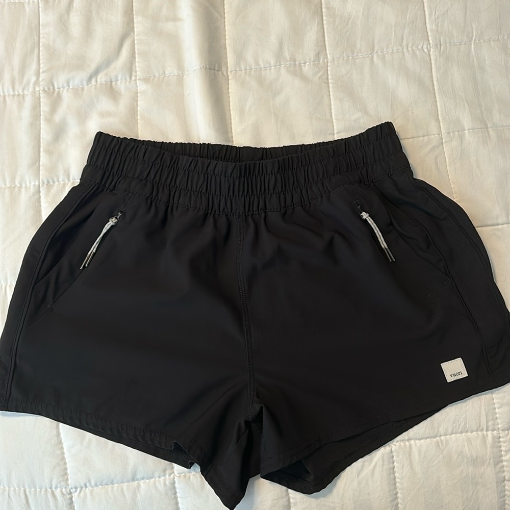 Black Vuori running shorts